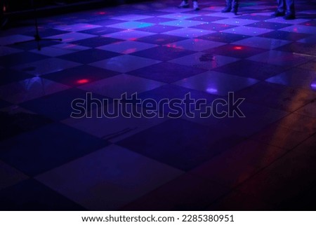 Music and color. Dance floor. Disco and floor lighting. Spotlights of different colors.