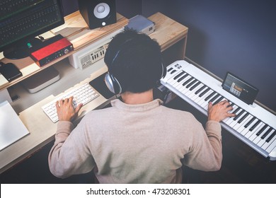 Music Composer Making Songs In Recording Studio