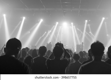 Music concert crowds illuminated from stage lights (very shallow depth of field) - Black and White