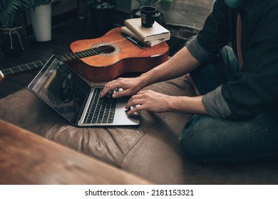  Music Creator Create Melody Song, Lyrics On Laptop While Sitting On Sofa Bed In Living Room At Home.