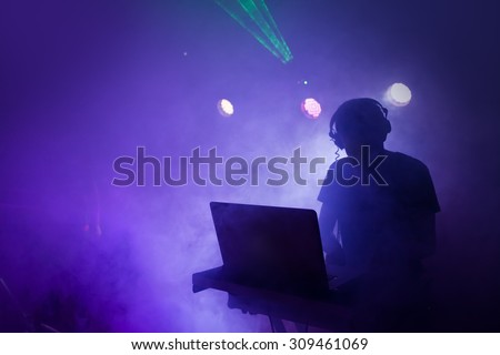 Music Dj mixing at nightclub party