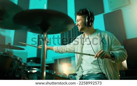 Music, drums and band with a man musician in a studio for a recording, performance or practice. Art, instrument and sound with a young male drummer expressing musical or artistic talent in a studio