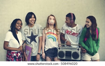 Similar – Happy young people walking along road in summer day