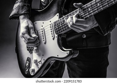 Music festival. Man playing guitar. Close up hand playing guitar. Musician playing guitar, live music. Black and white. Musical instrument. Electric guitar. Repetition of rock music band - Powered by Shutterstock