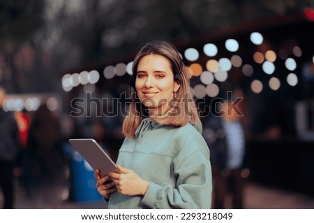
Music Festival Organizer Wearing a Headset Holding a Pc Tablet. Confident public relations specialist hosting a concert event
