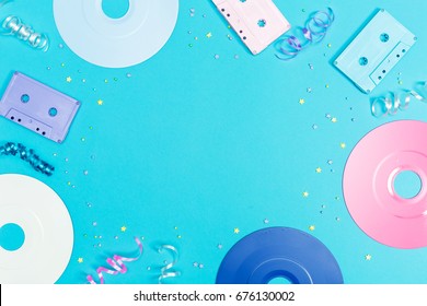 Music Flat Lay Objects With Vinyl Records And Cassette Tapes On A Blue Background