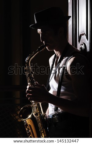 Music in his soul. Black and white shot of men playing saxophone