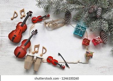 Music Instruments, Notes, Gifts , Paper With Christmas Tree On Wooden Background 