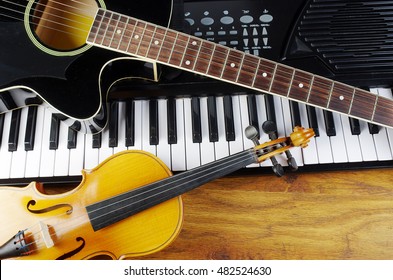 Music keyboard, acoustic guitar, violin.