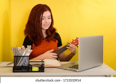 Music Lessons Online At Home. Young Girl Learn Music Class Online At Home. Homeschooling And Remote Education For Teenagers. 