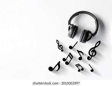 Music Lovers Background. Headphones On A White Table