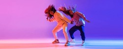 Music In Moves. Young Expressive Hip-hop Dancers Dancing In Neon. Concept Of Dance, Youth, Hobby, Dynamics, Movement, Action, Ad. Banner With Copy Space