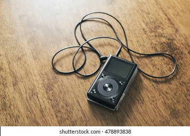 Music mp3 player on a wooden desk