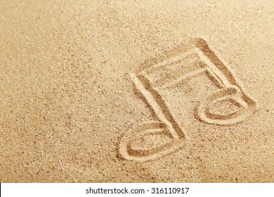 Music Note Drawn On A Beach Sand