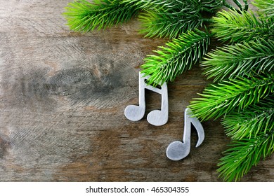 Music Notes And Christmas Tree On Wooden Background