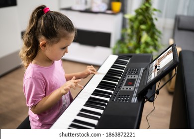 Music Piano Internet Class At Home. Studying Online - Powered by Shutterstock