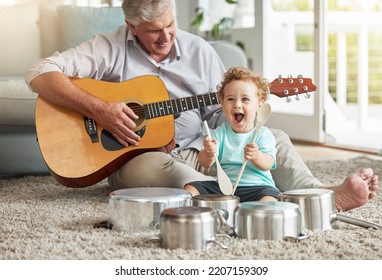 Music, Pots And Baby Drummer With Old Man On Living Room Floor With Pan And Wooden Spoon Instruments With His Guitar. Memory, Smile And Senior Grandparent Enjoys Time With A Happy Grandchild