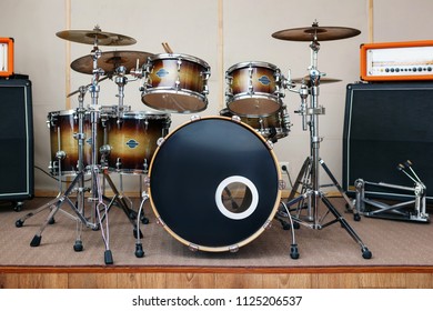 Music Rehearsal Space With Drum Kit And Musical Equipment.