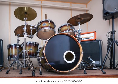 Music Rehearsal Space With Drum Kit And Musical Equipment.