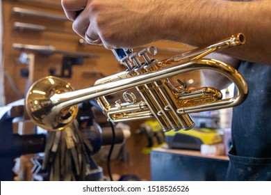 A Music Repair Technician Working On A Student Model Trumpet Repairing The Pinky Hook.