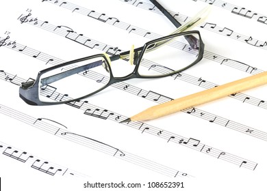 Music Sheet With Pencil And Glasses