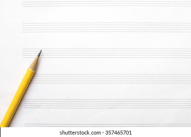Music Sheet And Yellow Pencil