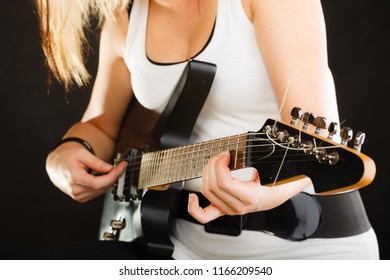 Music, Singing Concept. Musically Talented Woman Playing On Electric Guitar, Black Background