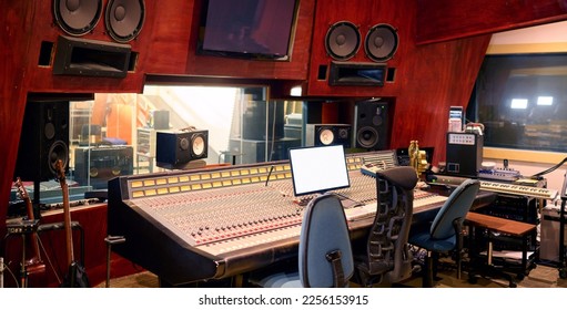 Music, studio and technology with recording equipment in an empty room for the entertainment industry. Interior, creative and audio with musical electronics to produce, record or control sound - Powered by Shutterstock