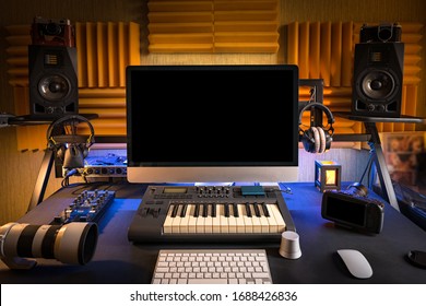 Music Studio Workplace Of Professional Musician Or Photographer At Home. A Lot Of Different Equipment On The Table For Content Production