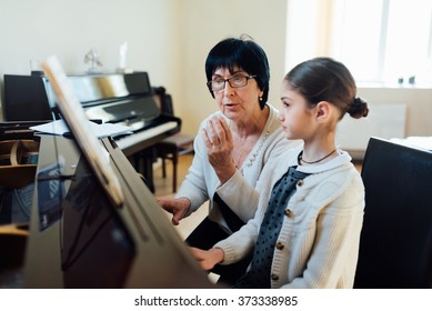 music teacher explains intricacies of playing the piano