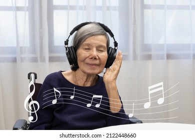 Music Therapy In Dementia Treatment On Elderly Woman.