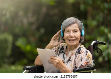 Music Therapy In Dementia Treatment On Elderly Woman.