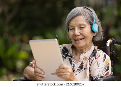 Music Therapy In Dementia Treatment On Elderly Woman.