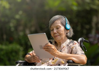 Music Therapy In Dementia Treatment On Elderly Woman.