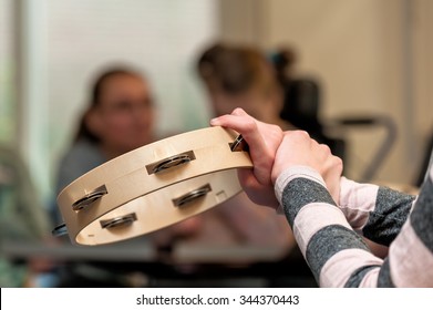 Music Therapy For Disabled Children Playing In A Group / Working With Mentally Handicapped People