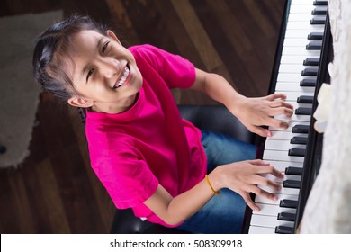 Music Therapy,smiling Girl Playing Piano