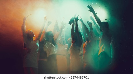 Music. Youth culture, night lifestyle. Vising concert. Group of young, active people at the night club, party dancing in neon lights. Concept of party, holiday, relaxation, meeting Copy space for ad - Powered by Shutterstock