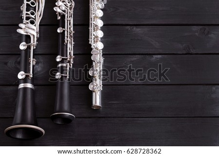 Musical background, poster - oboe, clarinet, flute, symphony orchestra. Musical still life. Free space for text.
