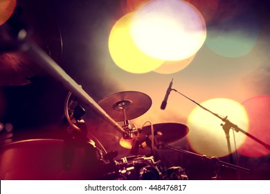 Musical background.Drum kit on stage lights performance.Live music.Concert and band on stage.Festival and show background