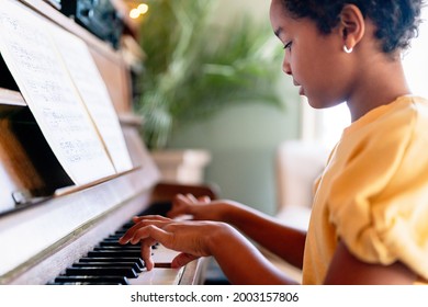 Musical Education. Happy Black Girl Playing The Piano