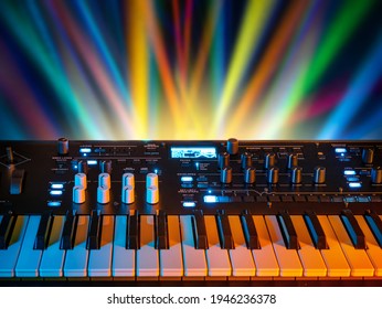 Musical instrument electronic synthesizer on a background of colored rays. Background on the theme of music, disco and synthesizer games.