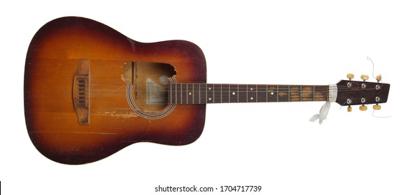 Musical instrument - Front view broken classic acoustic guitar isolated on a white background.