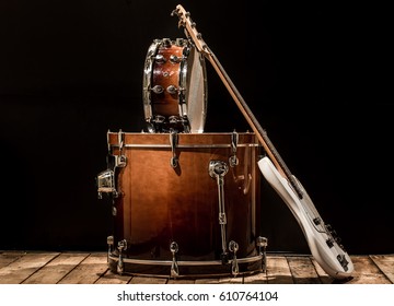 musical instruments, drum bass Bochka bass guitar on a black background, the music concept