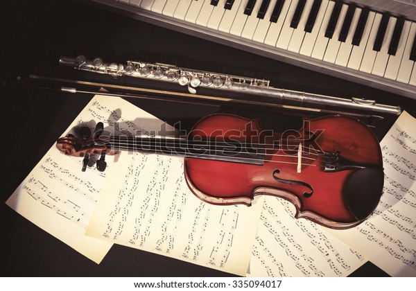 Musical\
instruments with music notes on dark\
background