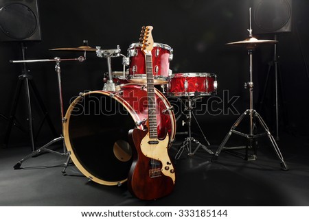 Musical instruments on a stage on dark background