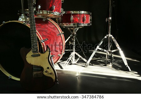 Musical instruments on a stage on dark background
