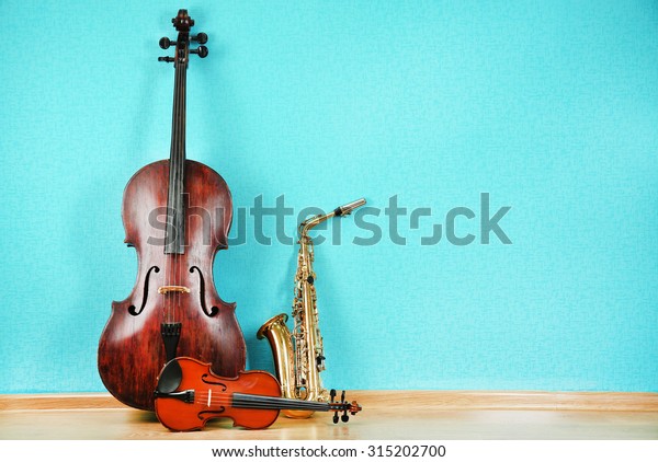 musical instruments on turquoise wallpaper background stock photo edit now 315202700 https www shutterstock com image photo musical instruments on turquoise wallpaper background 315202700