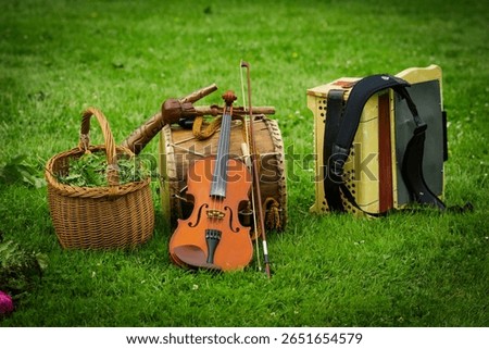 Musical instruments placed on the grass during a an annual Latvian festival celebrating the summer solstice