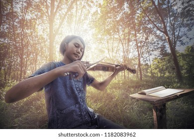 The Musical, Little Asian Child Playing Violin At Outdoors