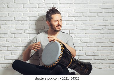 musician with african drum - Powered by Shutterstock